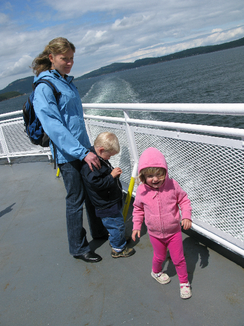 Toddlers and parent on ferry boat.